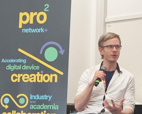 news_launch_02 Photo of Chris Snider speaking at the prosquared launch event with a prosquared poster to the left