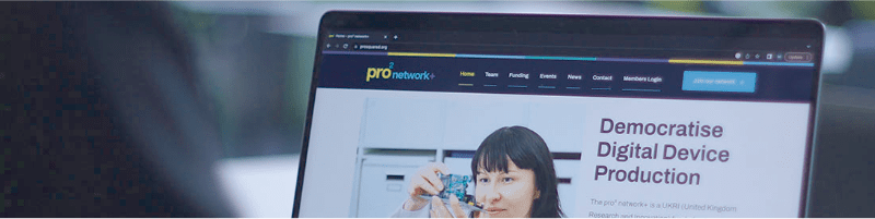 Photo of a person looking at the pro2 website on a laptop