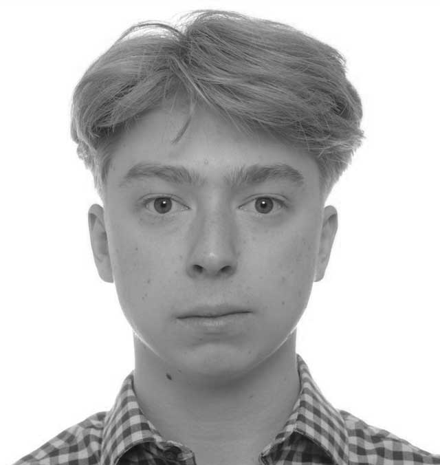 Aron-Eggens A black and white photo of Aron Eggens against a white background.