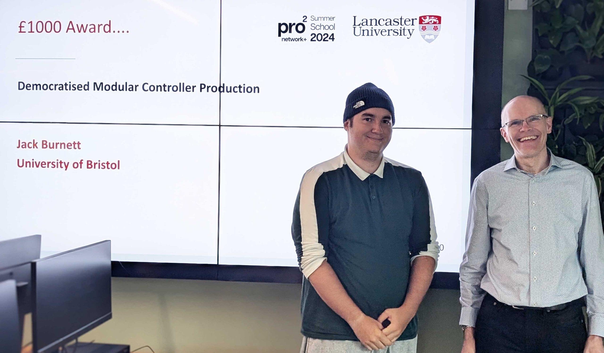 Jack_Burnett A summer school prize winner poses with Steve Hodges in a computer lab.