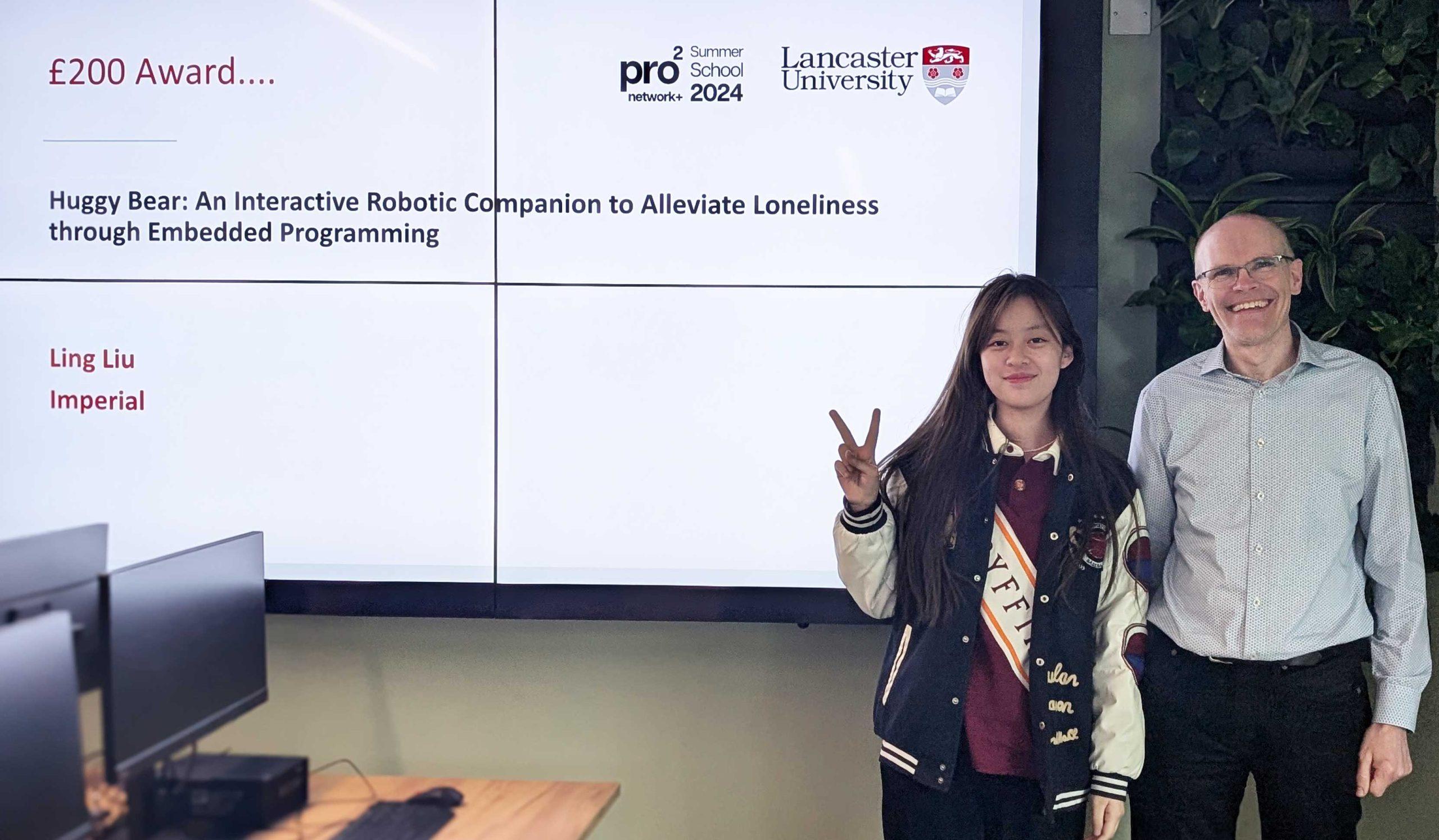 Ling_Liu A summer school prize winner poses with Steve Hodges in a computer lab.