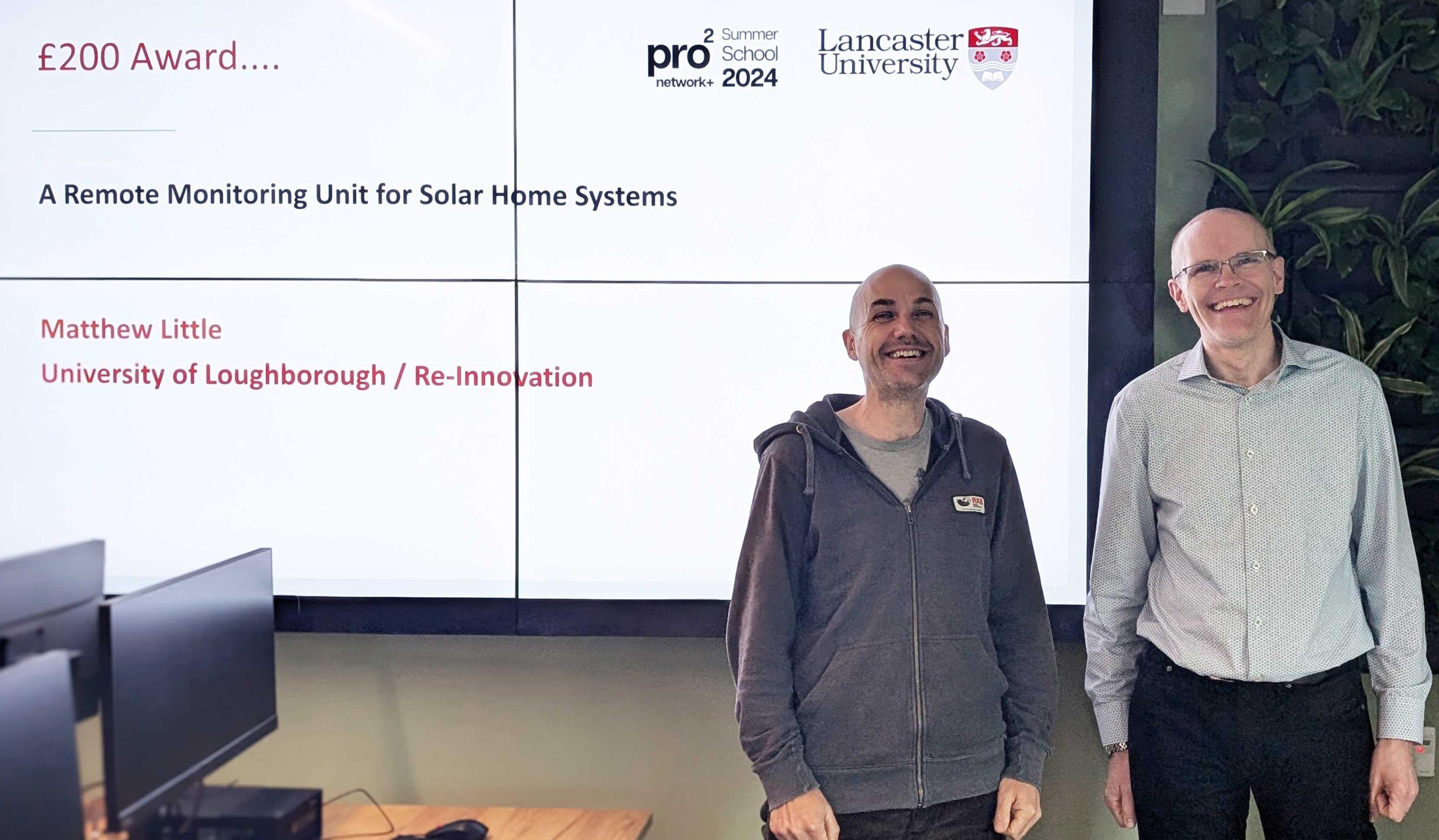 Matthew_Little A summer school prize winner poses with Steve Hodges in a computer lab.