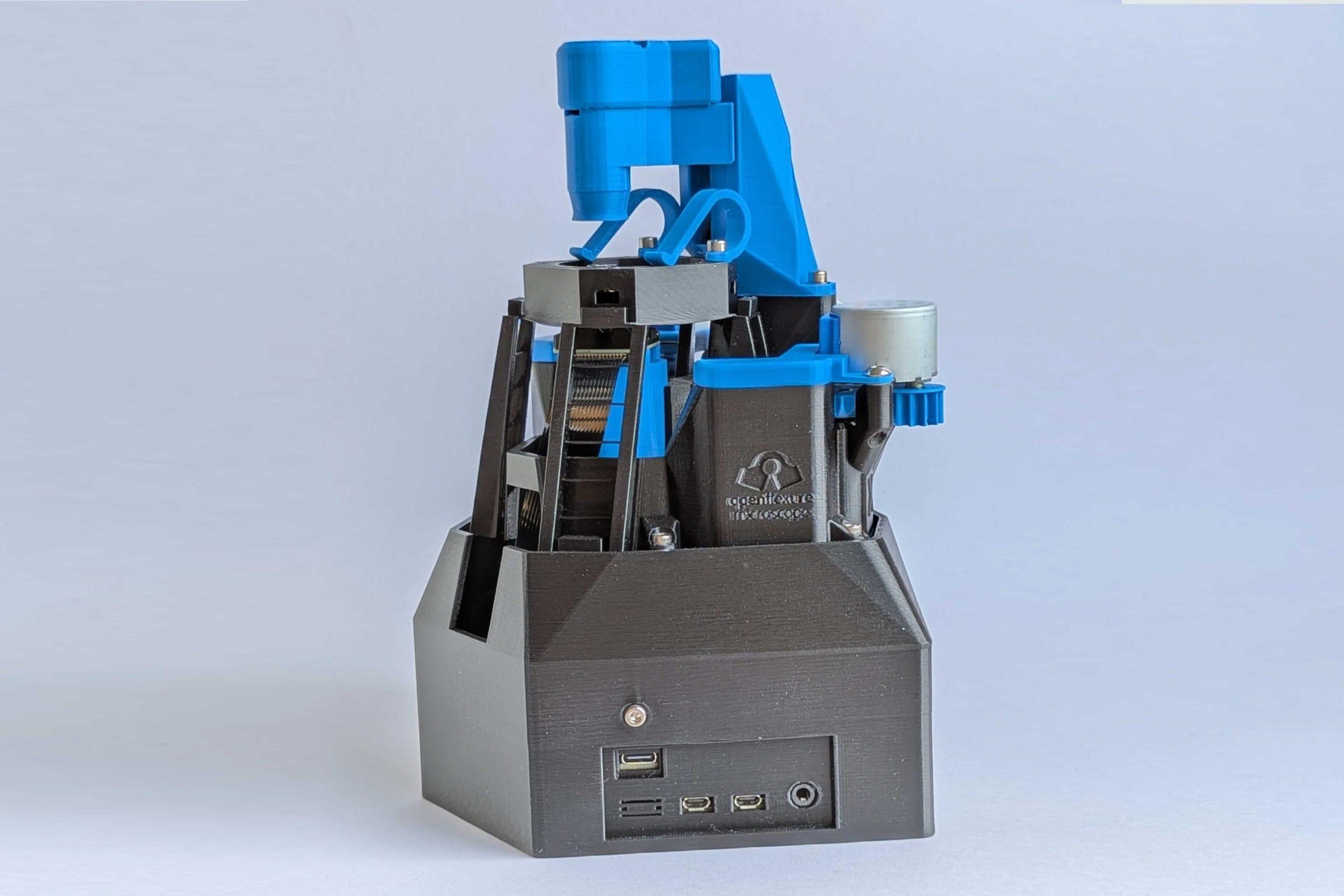 OpenFlexure_02 Photo of a 3D printed OpenFlexure microscope against a gray background.