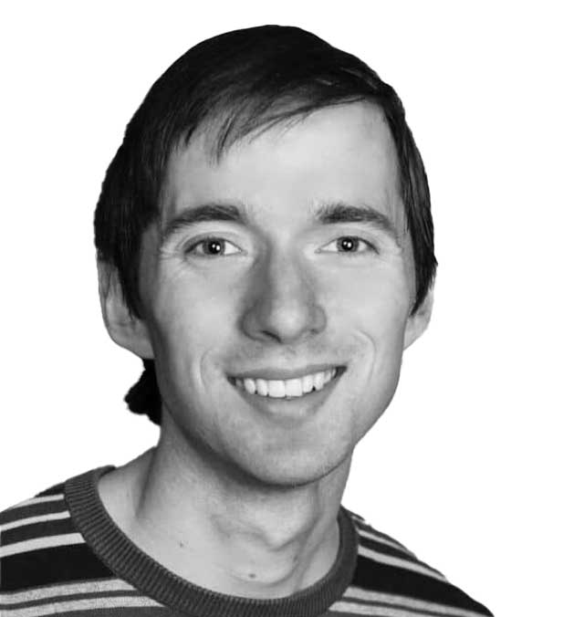 RichardBowman A black and white photo of Richard Bowman, smiling and looking at the camera.
