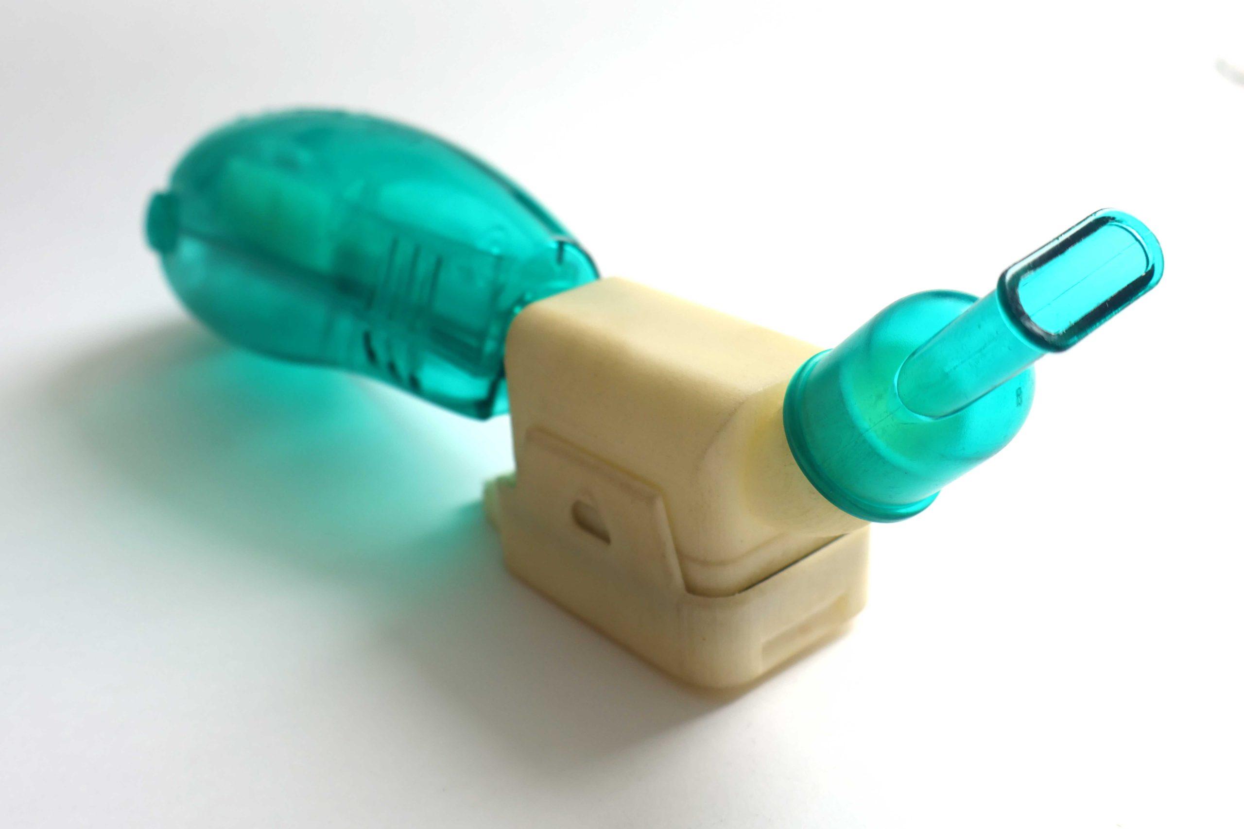 robust_04 A chest physiotherapy device with an embedded electronic component, sitting on a white background.