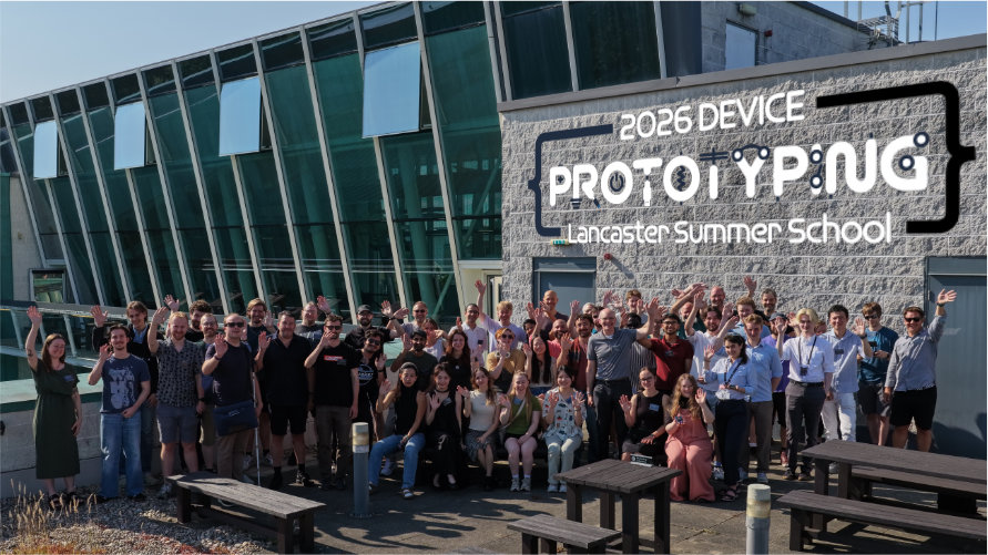 A photo shows summer school attendees standing outside in front of a Lancaster University building on a sunny day, waving to the camera. Behind them is the text 2026 Device Prototyping Summer School